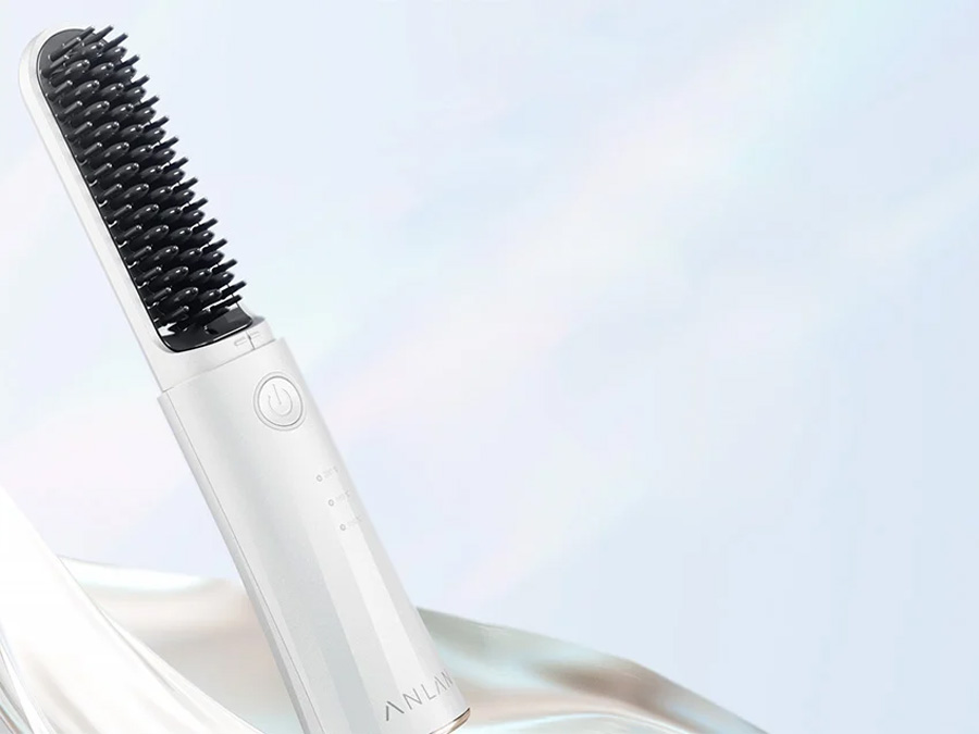 Jonizująca szczotka do stylizacji włosów ANLAN 05-AZFS41-02A zasilana akumulatorowo, zaprezentowana na jasnym tle z efektem jedwabistego materiału